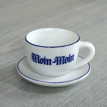 Tee-Söpke Tasse mit Untertasse Aufdruck Moin Moin